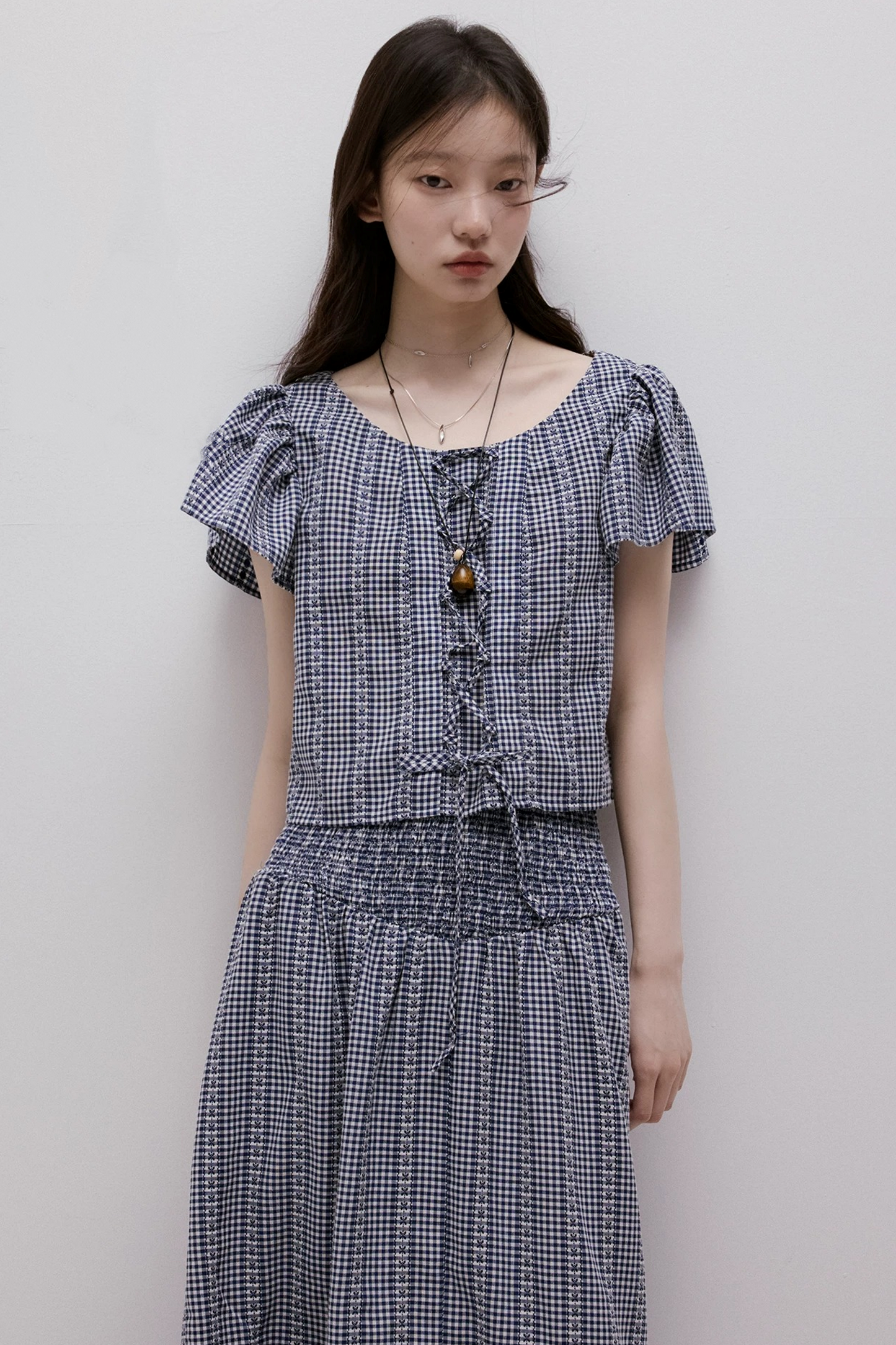 Maglia vichy blu con lacci