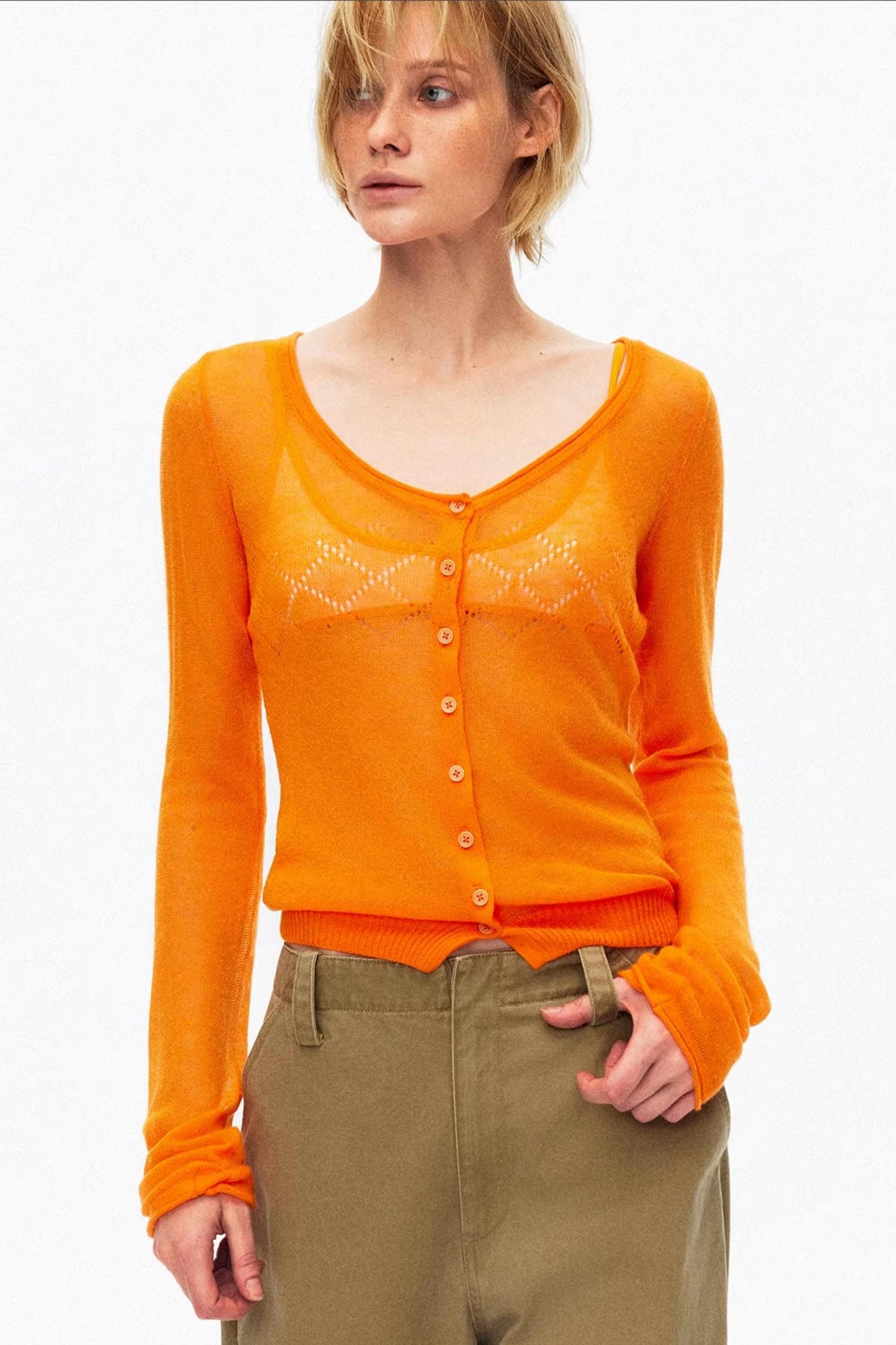 Vibrant orange lightweight hollow-out knit cardigan for stylish layering