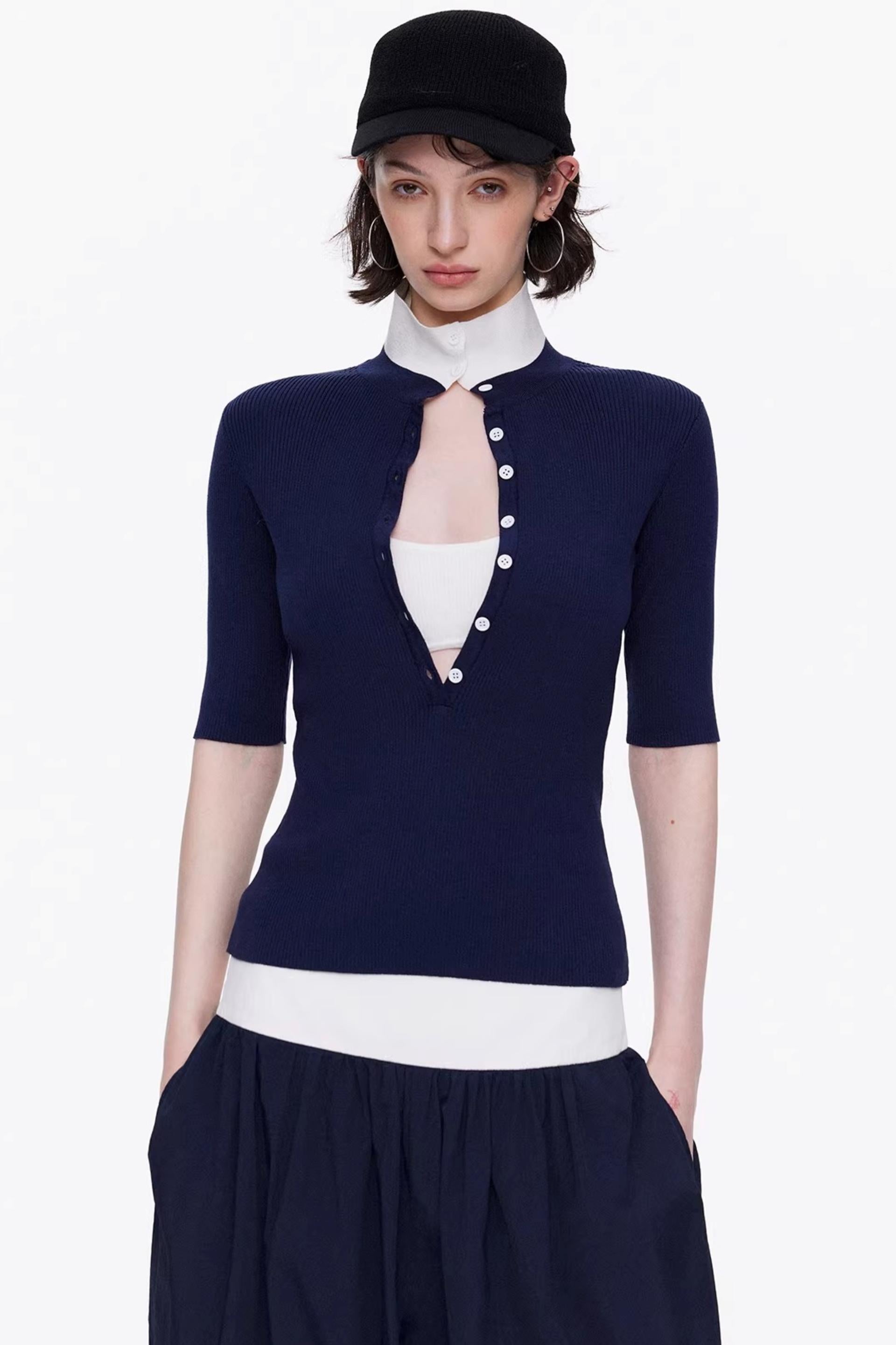 Elegant navy blue and white color-blocked lyocell knit top