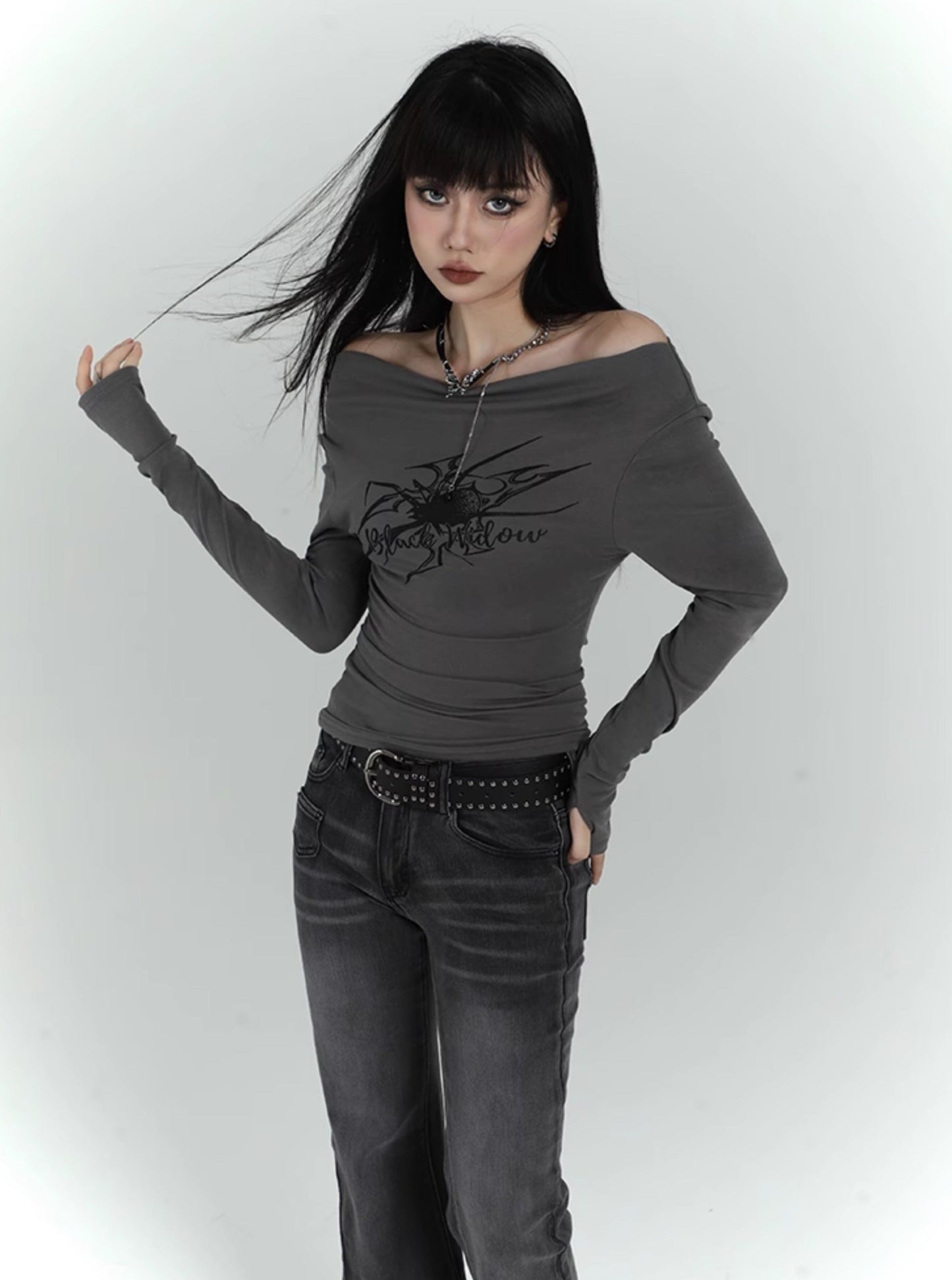 figure-showing one-shoulder long-sleeved top