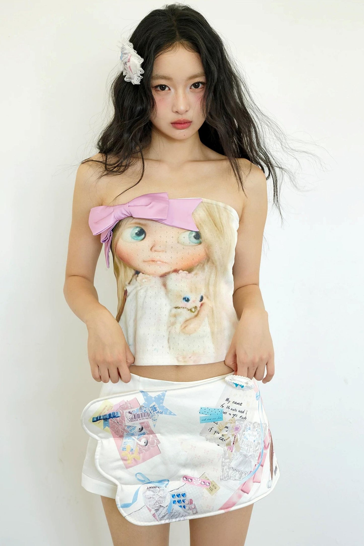 Rosa Strickoberteil mit Schleife im Puppenstil