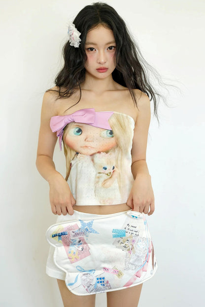 Rosa Strickoberteil mit Schleife im Puppenstil