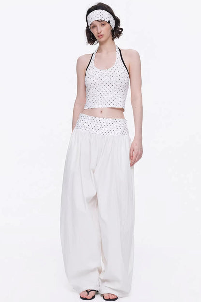 Elegant off-white minimalist knitted set featuring a tube top and wide-leg pants