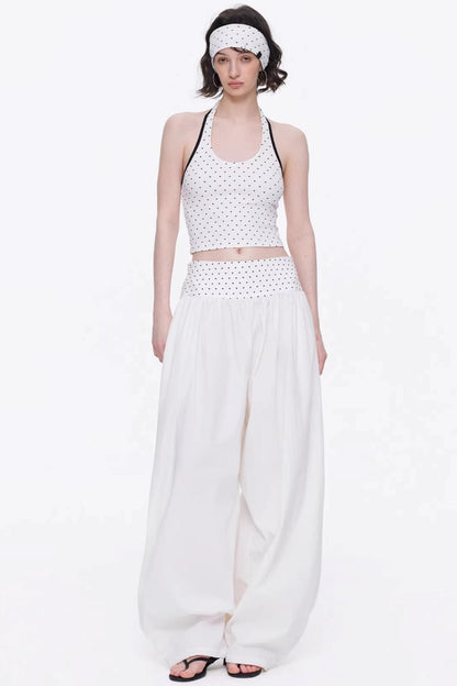Elegant off-white minimalist knitted set featuring a tube top and wide-leg pants