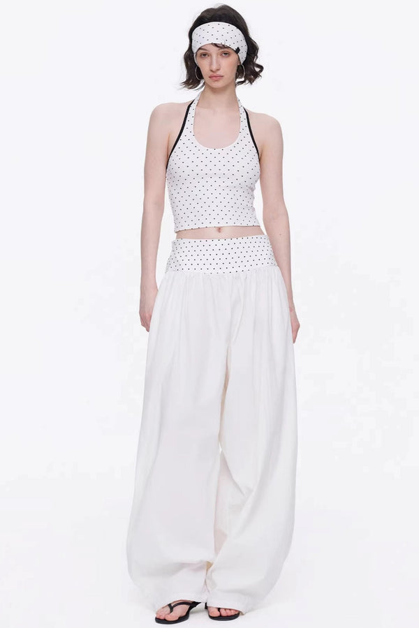 Elegant off-white minimalist knitted set featuring a tube top and wide-leg pants