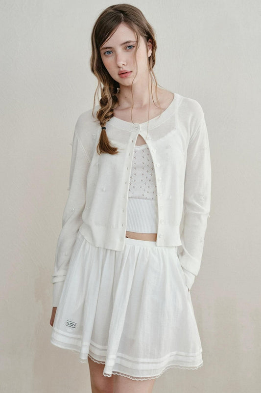 Cardigan en maille perlée battement de cœur