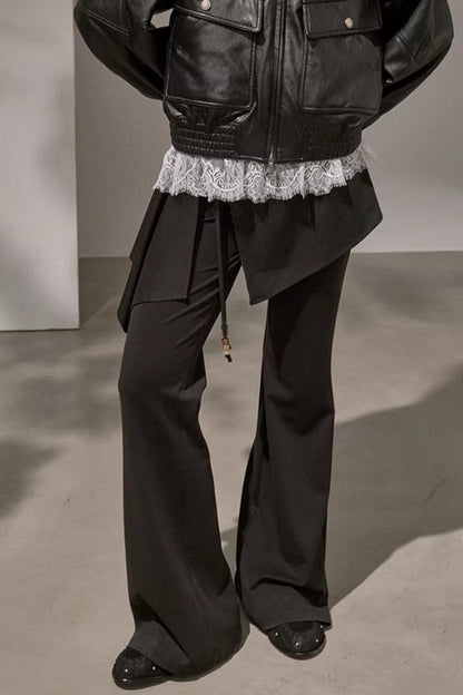 Edgy black high-waisted patchwork flared trousers for streetwear style
