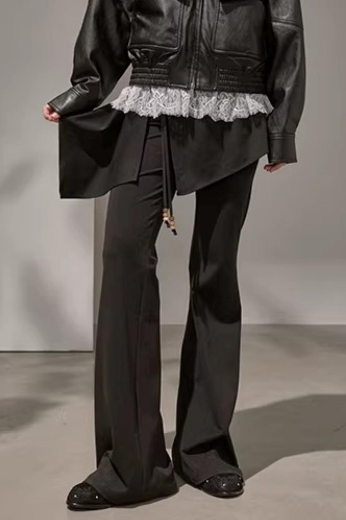 Edgy black high-waisted patchwork flared trousers for streetwear style