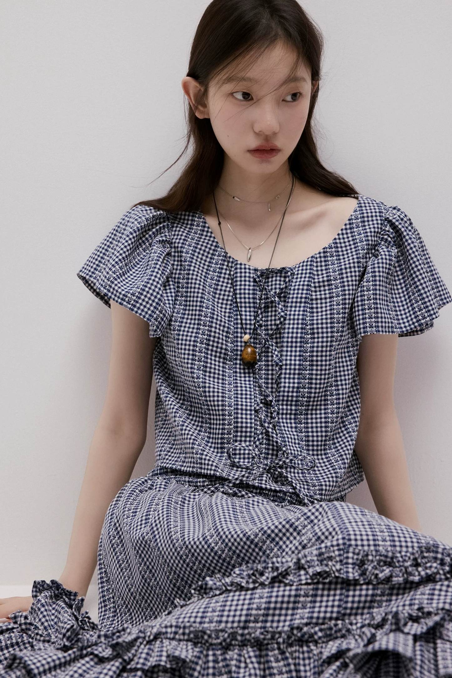 Maglia vichy blu con lacci