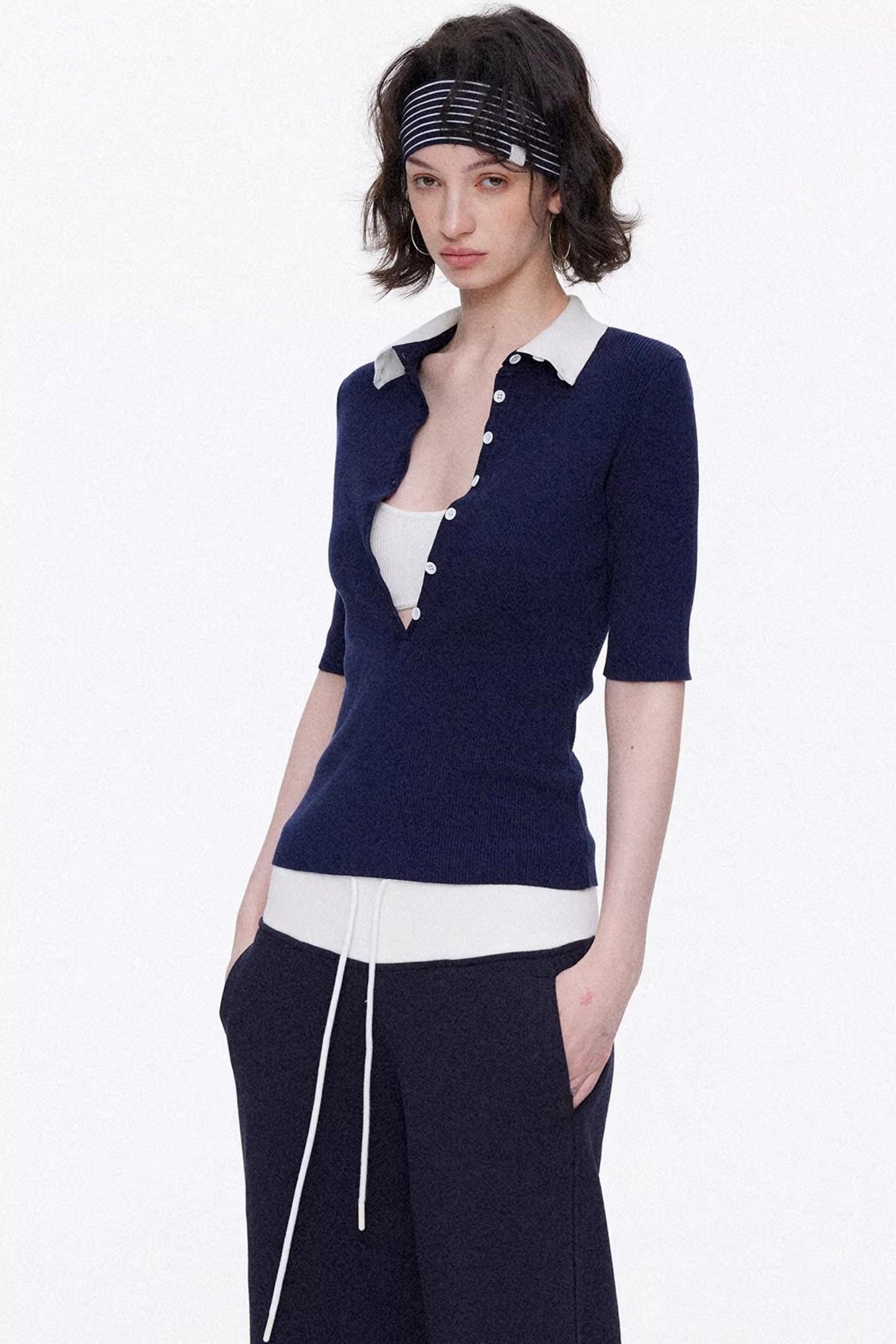 Elegant navy blue and white color-blocked lyocell knit top