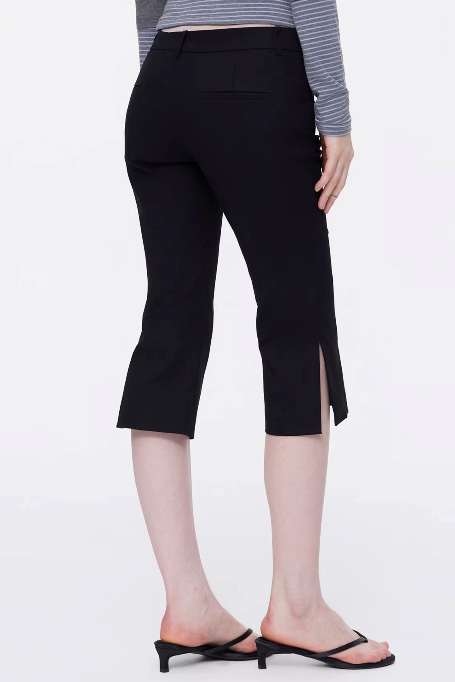 Sleek black low-waist equestrian capri trousers for a trendy Y2K look back view