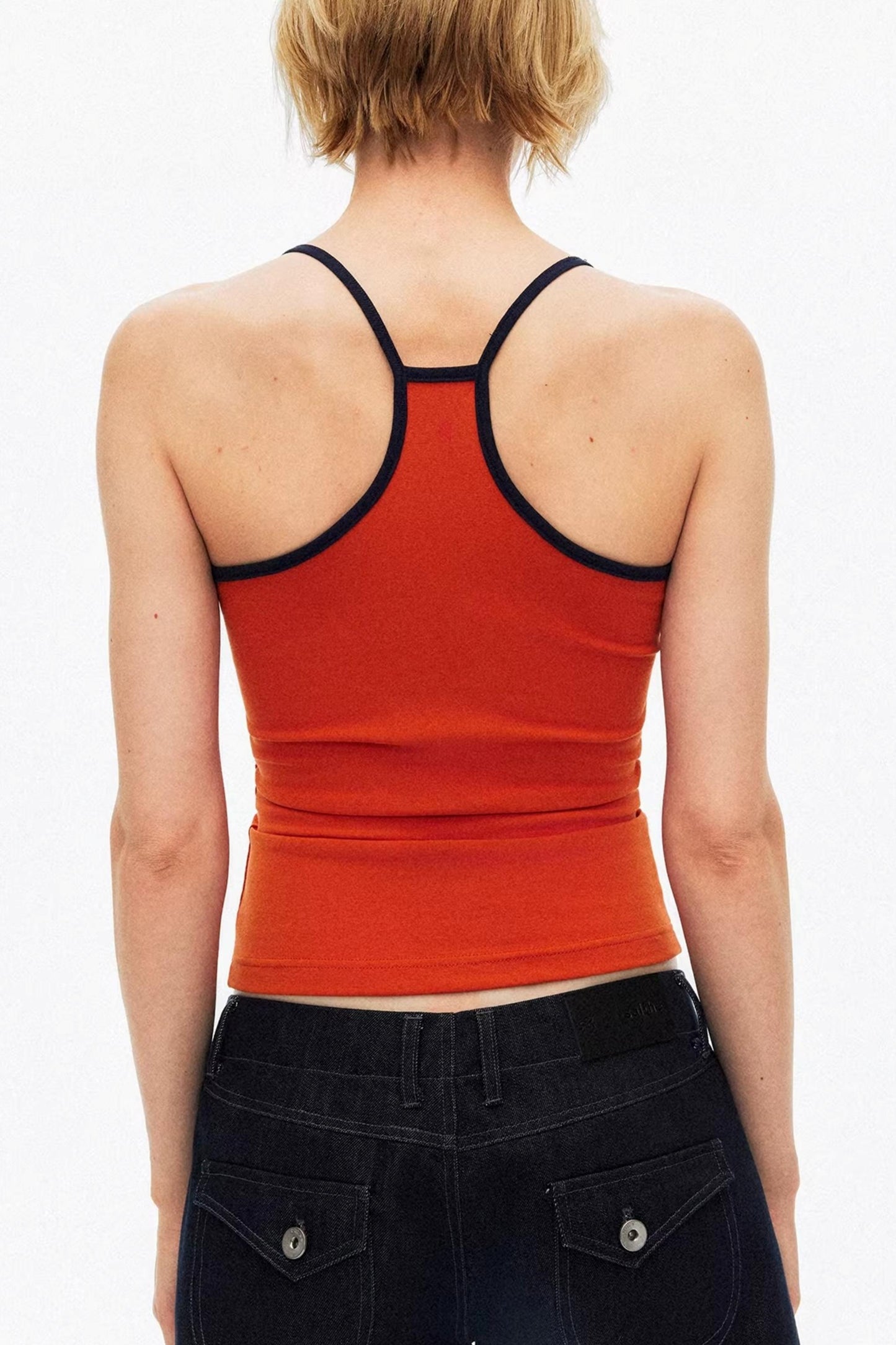 Sporty orange color-block vest close-up