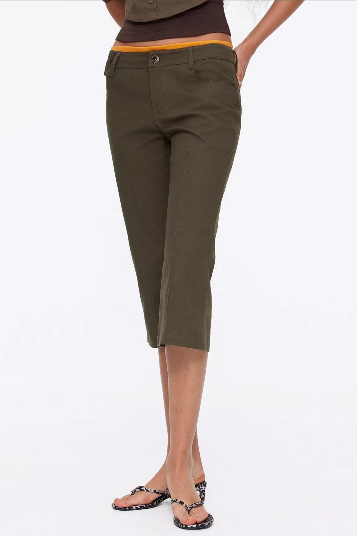 Vintage army green flared capri pants with exposed seam design