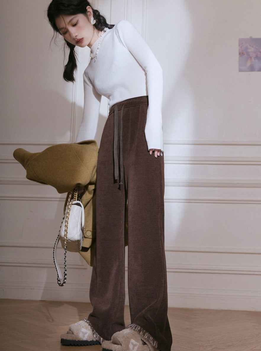 Cut-out raw knitted flared trousers