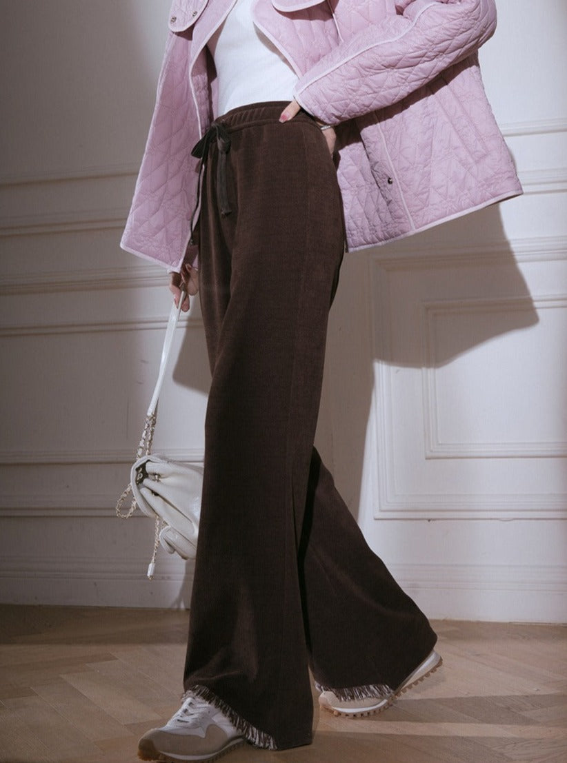 Cut-out raw knitted flared trousers