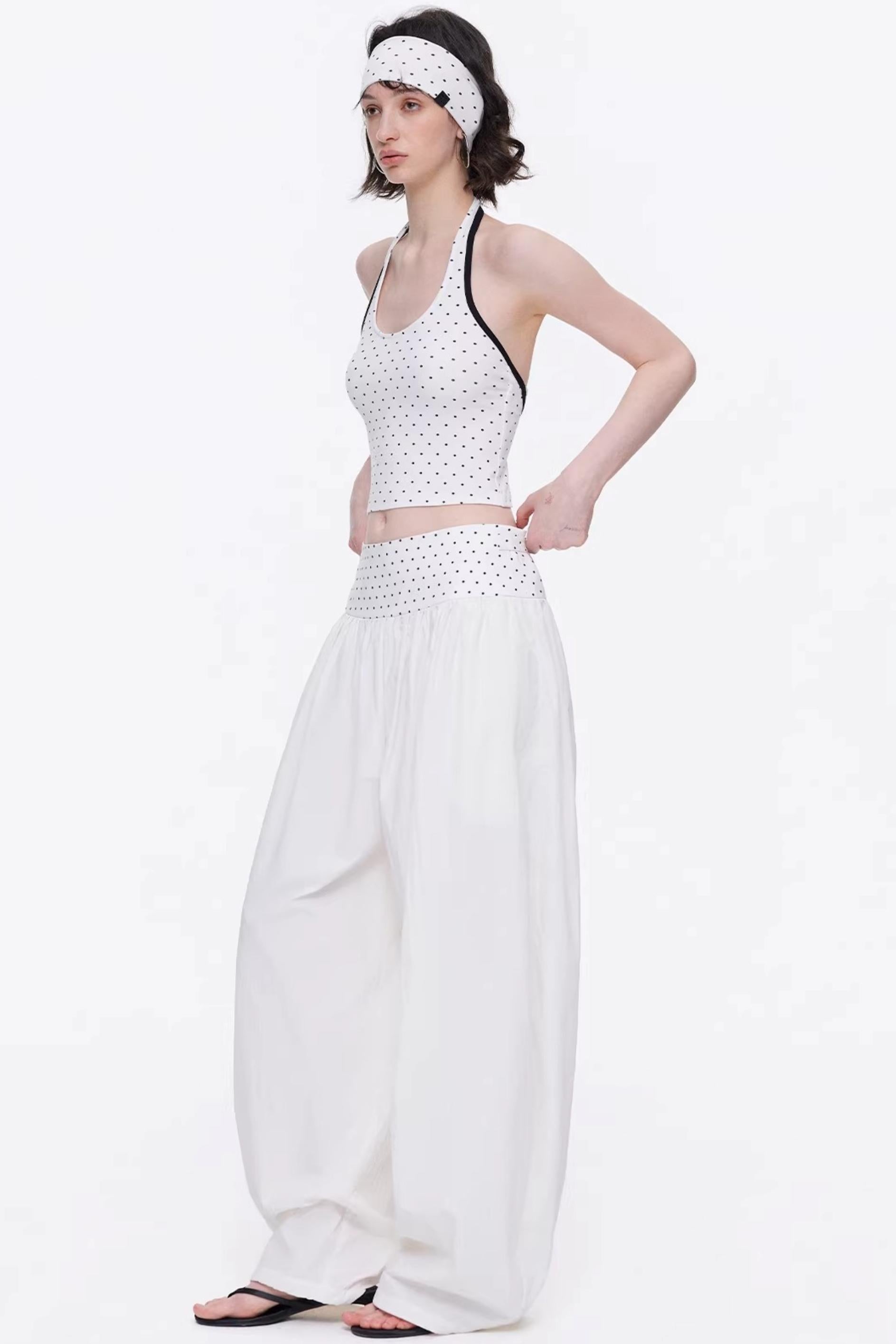 Elegant off-white minimalist knitted set featuring a tube top and wide-leg pants