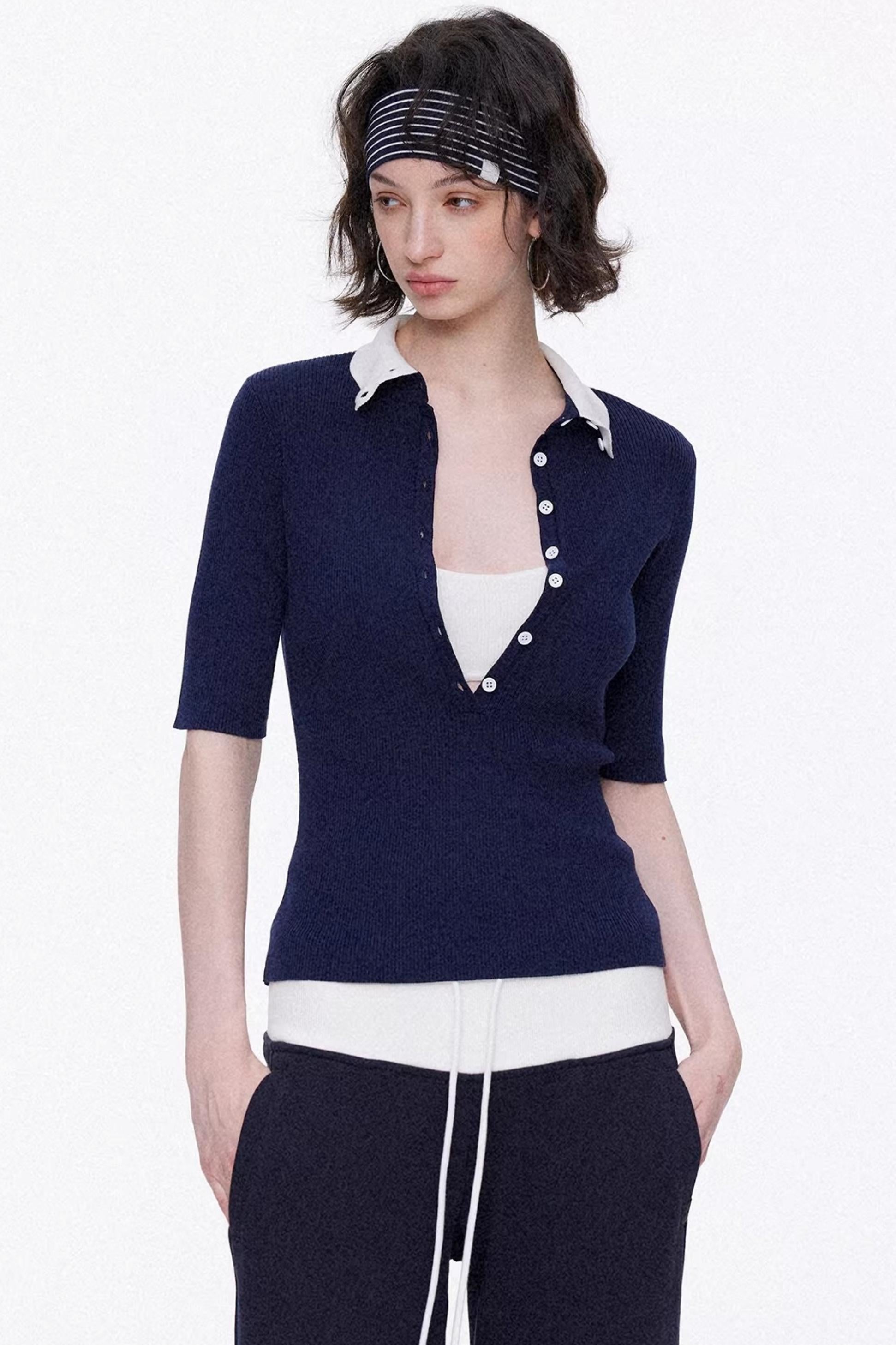 Elegant navy blue and white color-blocked lyocell knit top