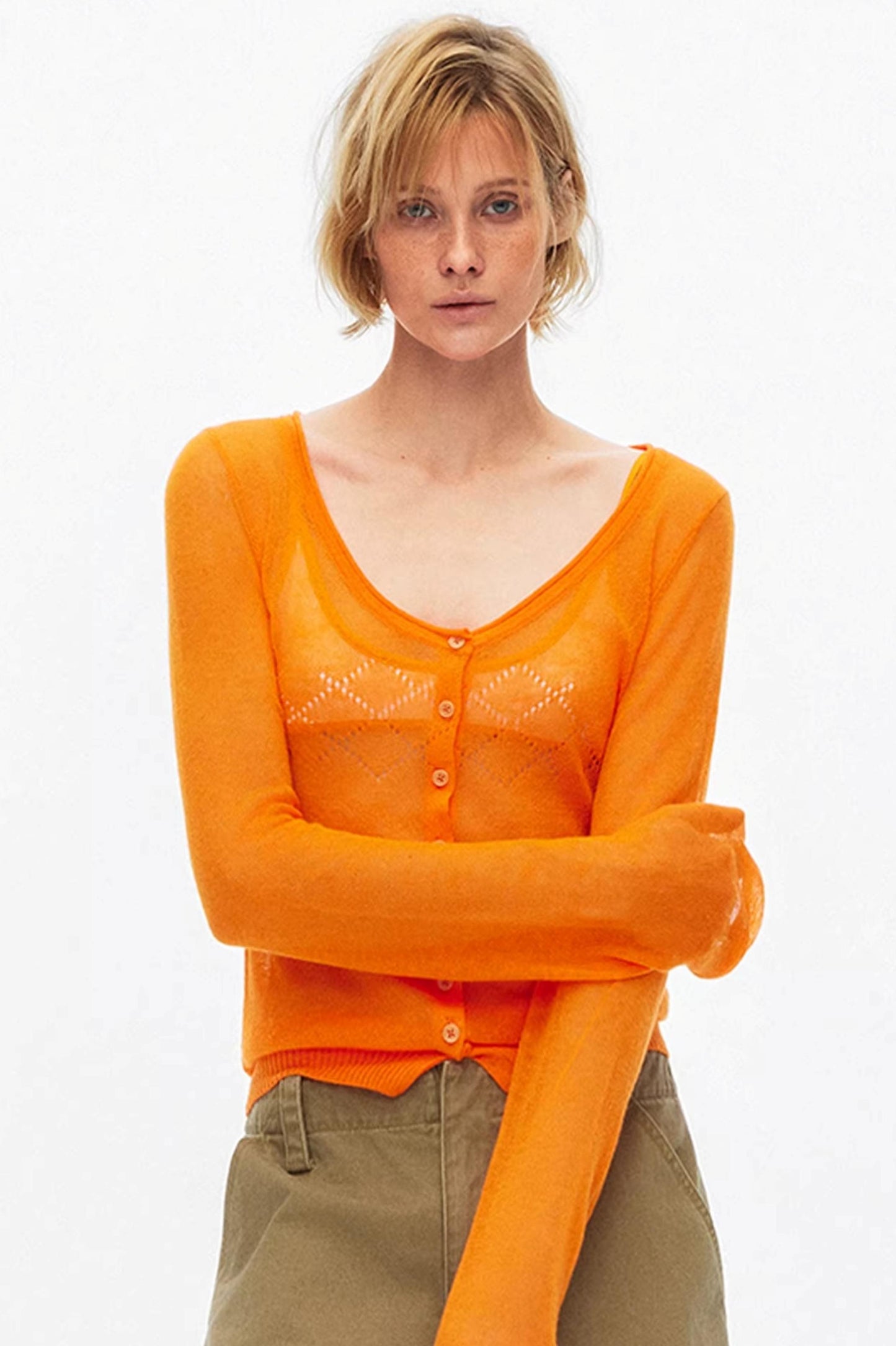 Vibrant orange lightweight hollow-out knit cardigan for stylish layering