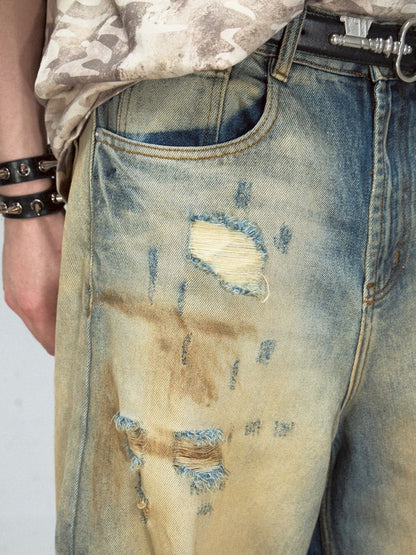 Yellow mud dyed ripped blue straight jeans