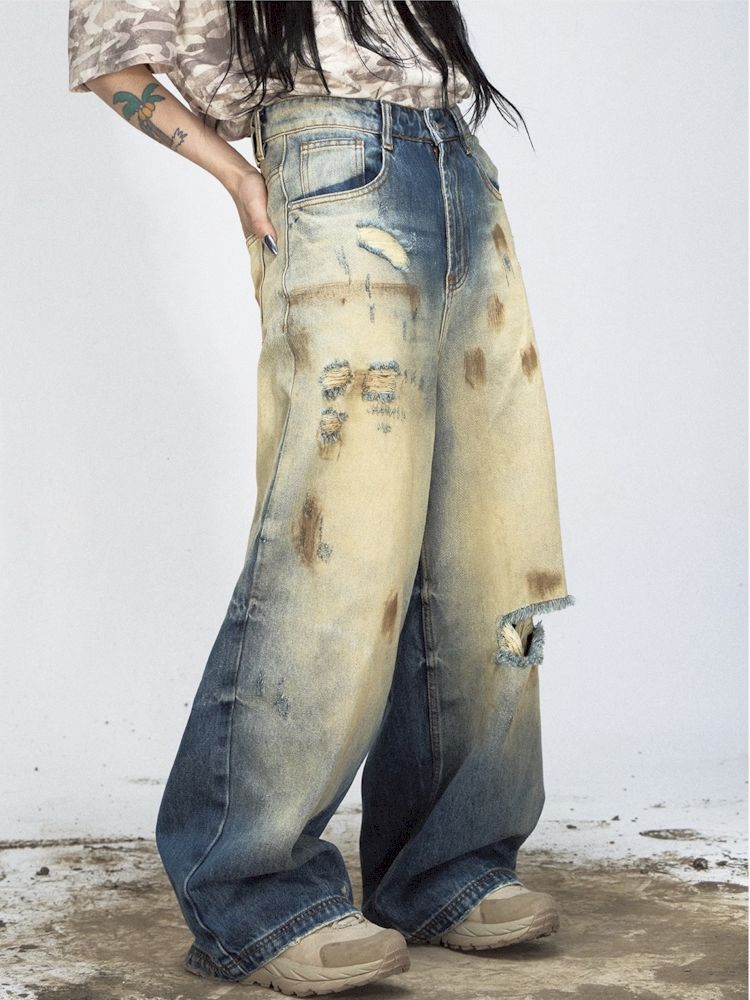 Yellow mud dyed ripped blue straight jeans