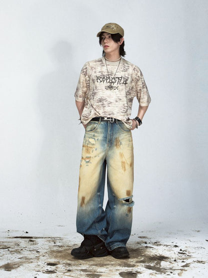 Yellow mud dyed ripped blue straight jeans