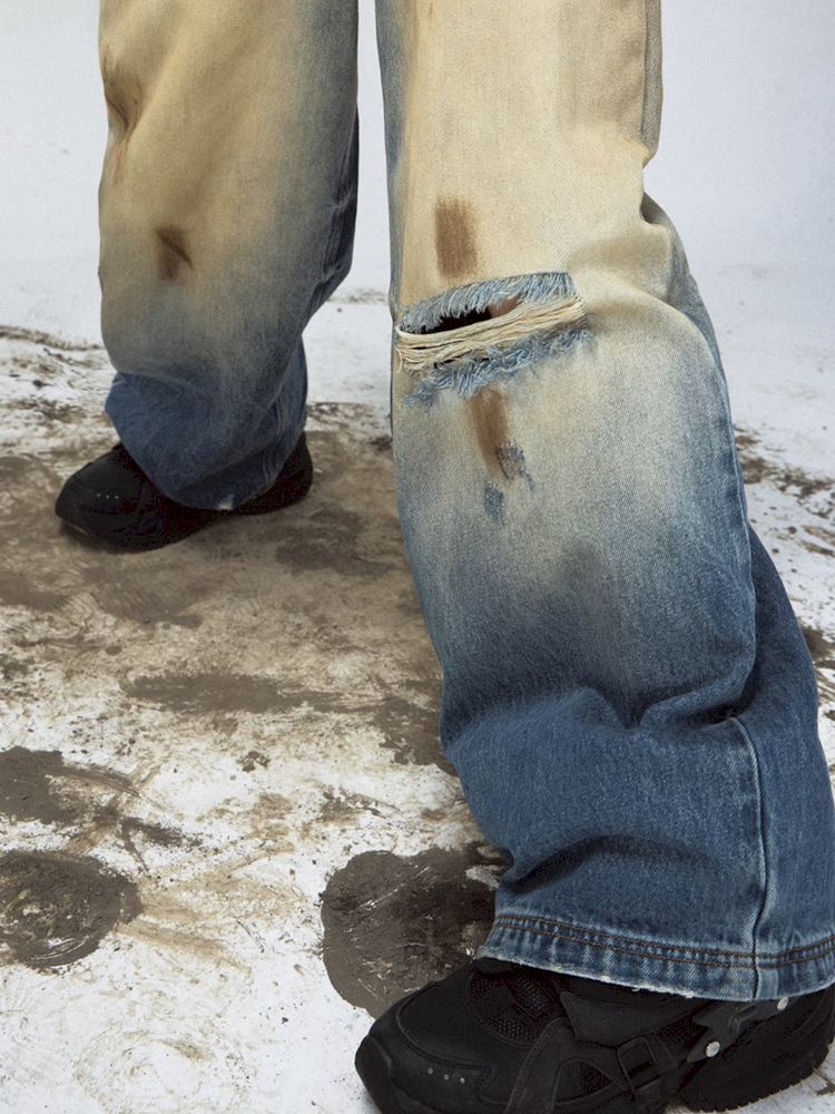 Yellow mud dyed ripped blue straight jeans