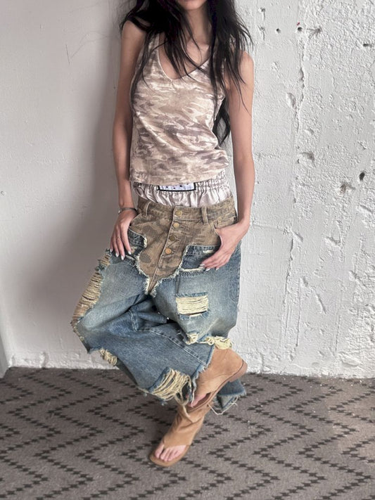 Low-rise ripped camouflage patchwork denim