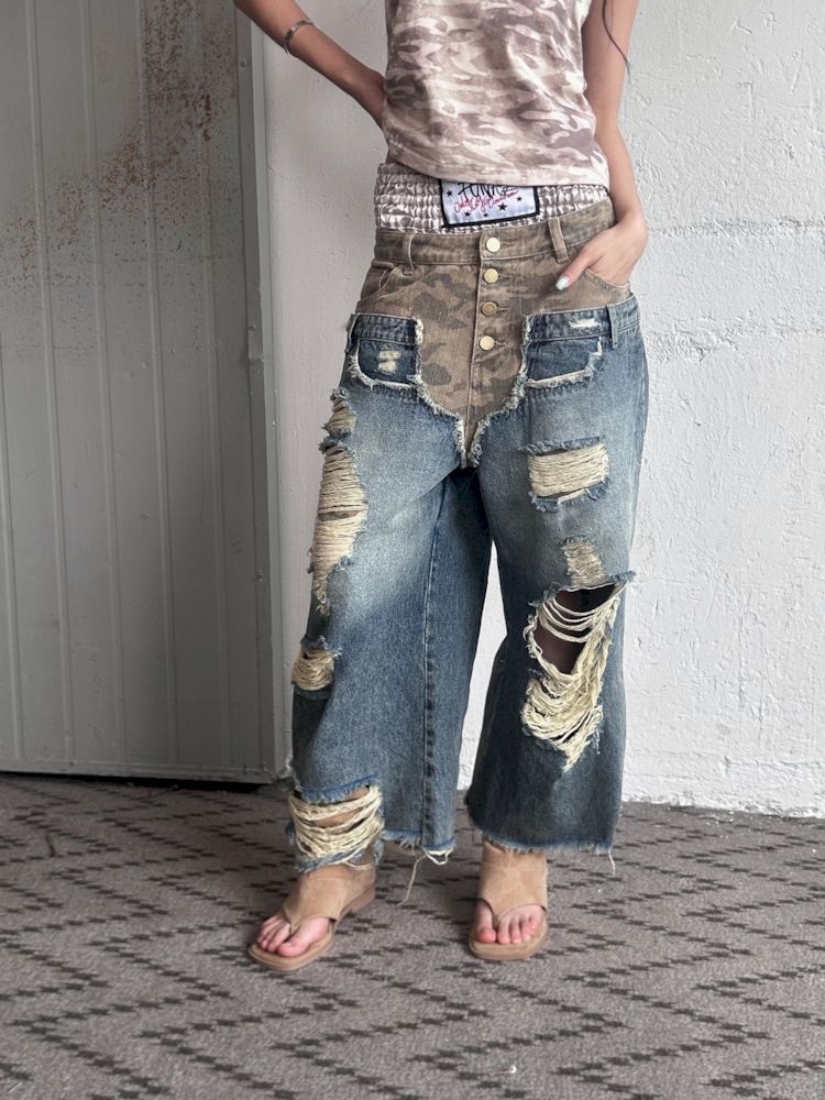 Low-rise ripped camouflage patchwork denim