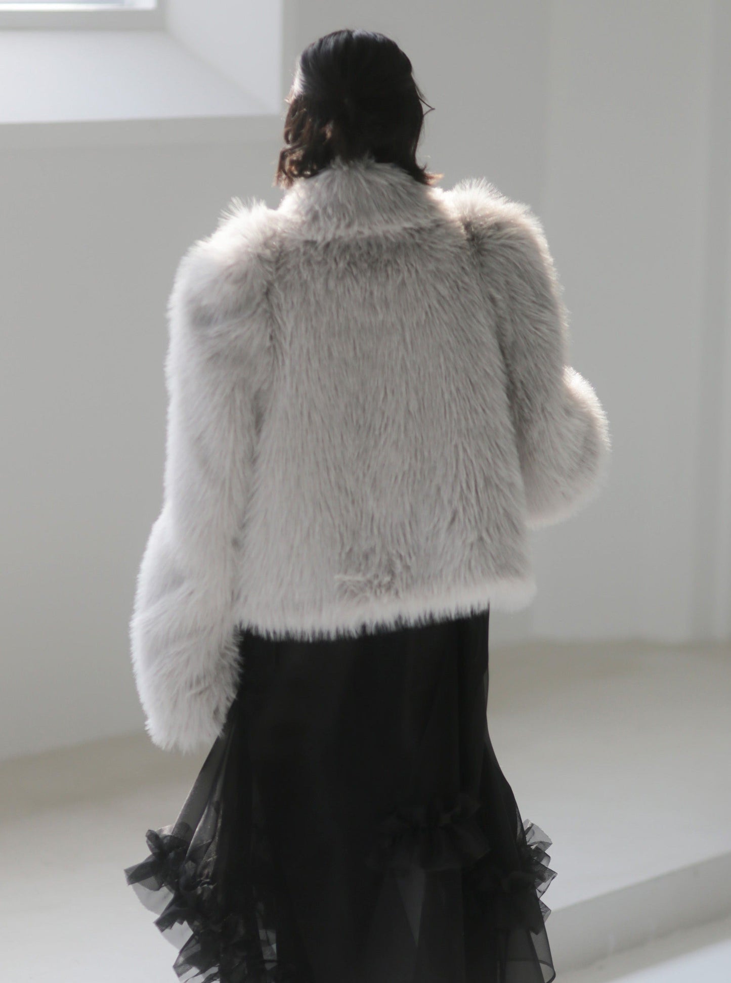 Hand-beaded bows embellished faux-fur coat