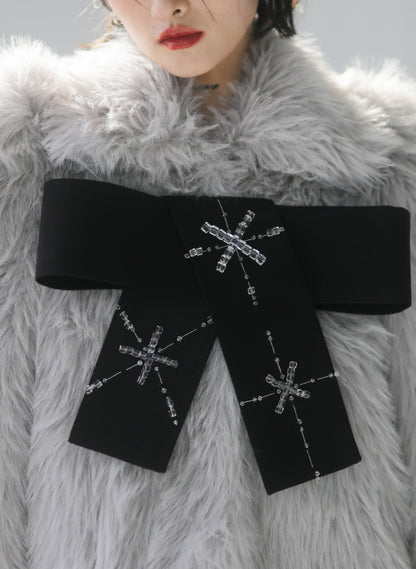 Hand-beaded bows embellished faux-fur coat