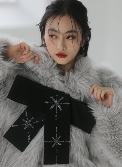 Hand-beaded bows embellished faux-fur coat