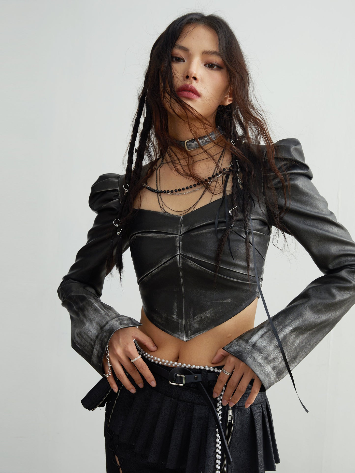 Chain embellished rubbed faux-leather short tops