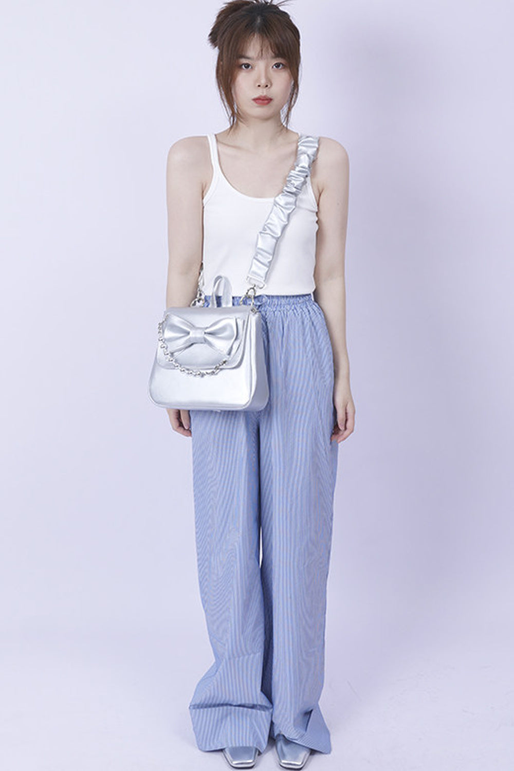 Silver Bow Crossbody Backpack