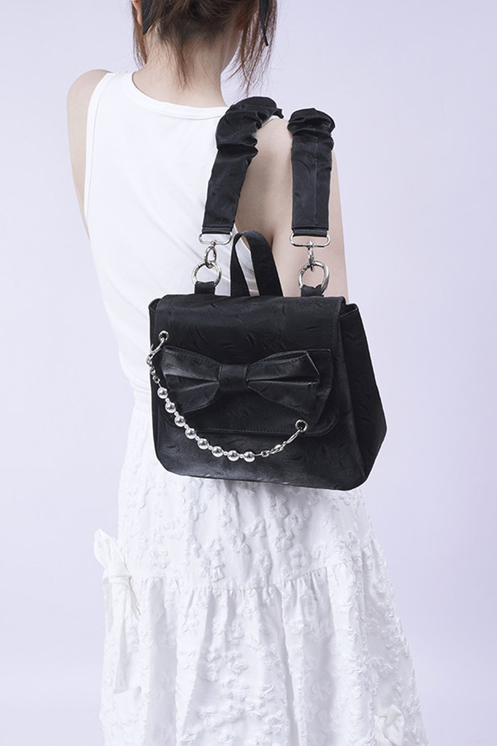 Silver Bow Crossbody Backpack