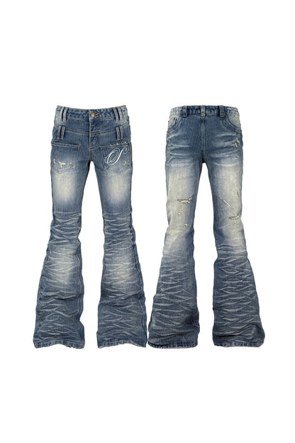 Wendbare Schlagjeans mit Taschen, Patchwork und Stickerei