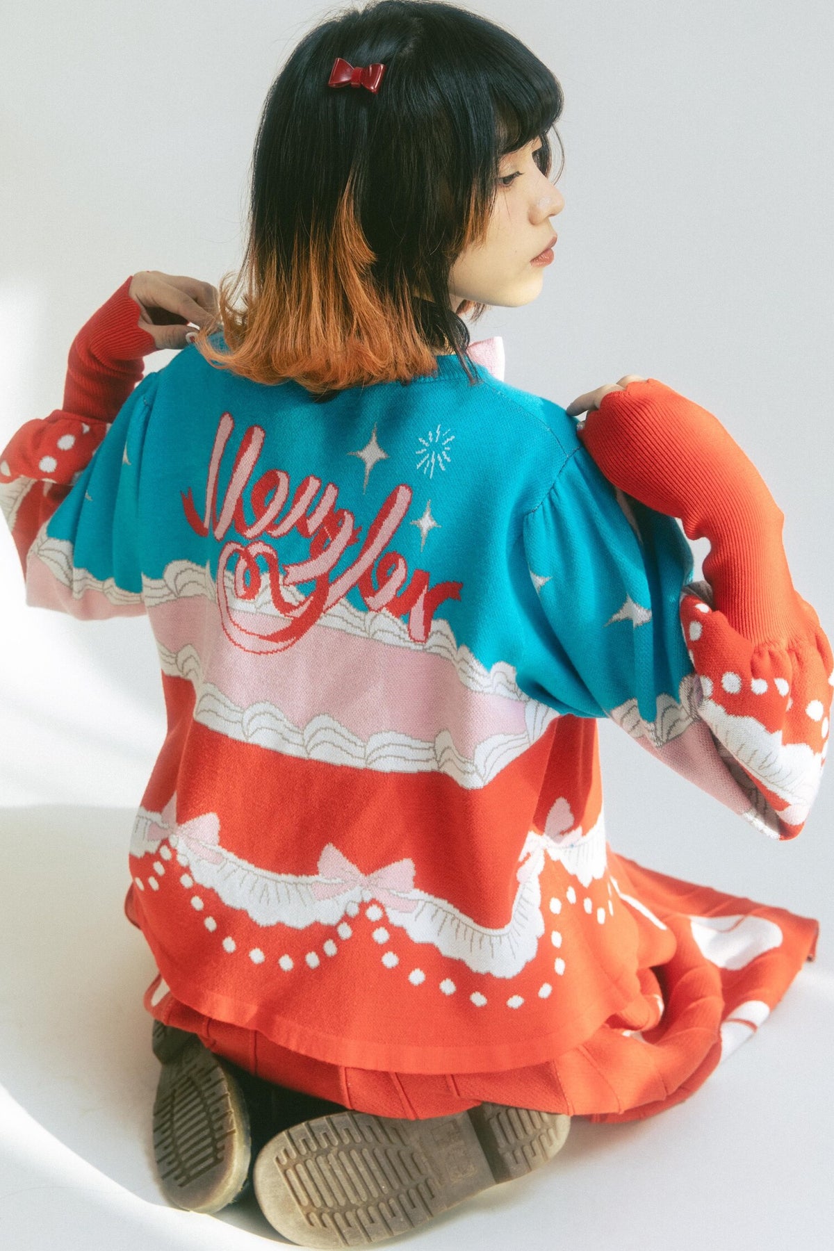 Cardigan a maglia con fiocco e coniglio