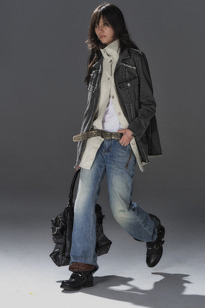 Jeans blu a vita bassa effetto consumato con borchie