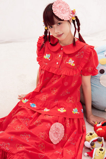 Blusa rossa con ricamo animale e angelo