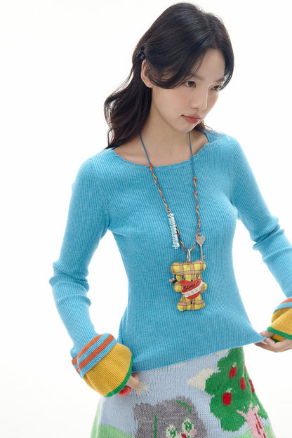 Collier long avec pendentif ours à carreaux