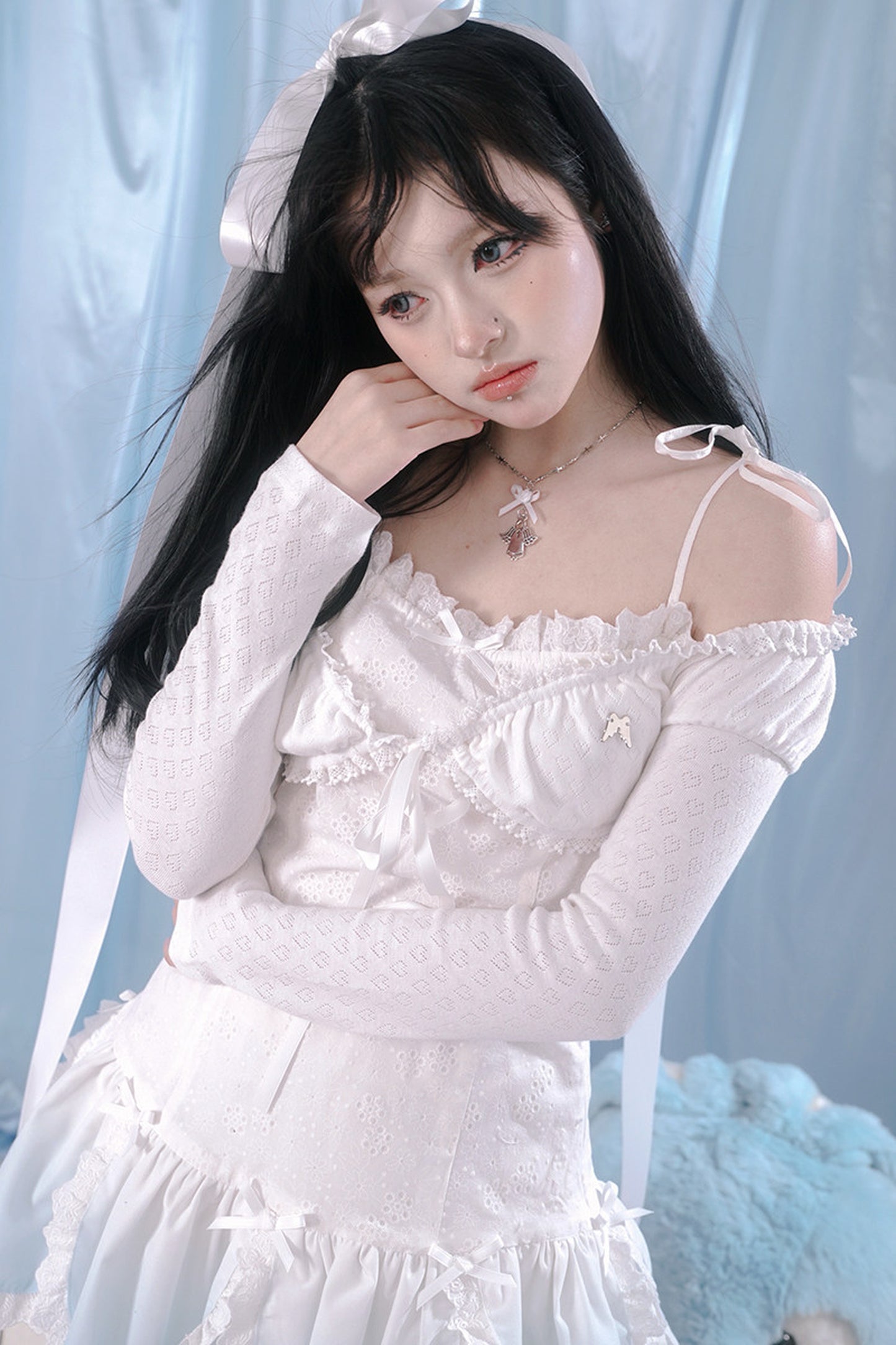 Top in maglia con pizzo a forma di cuore
