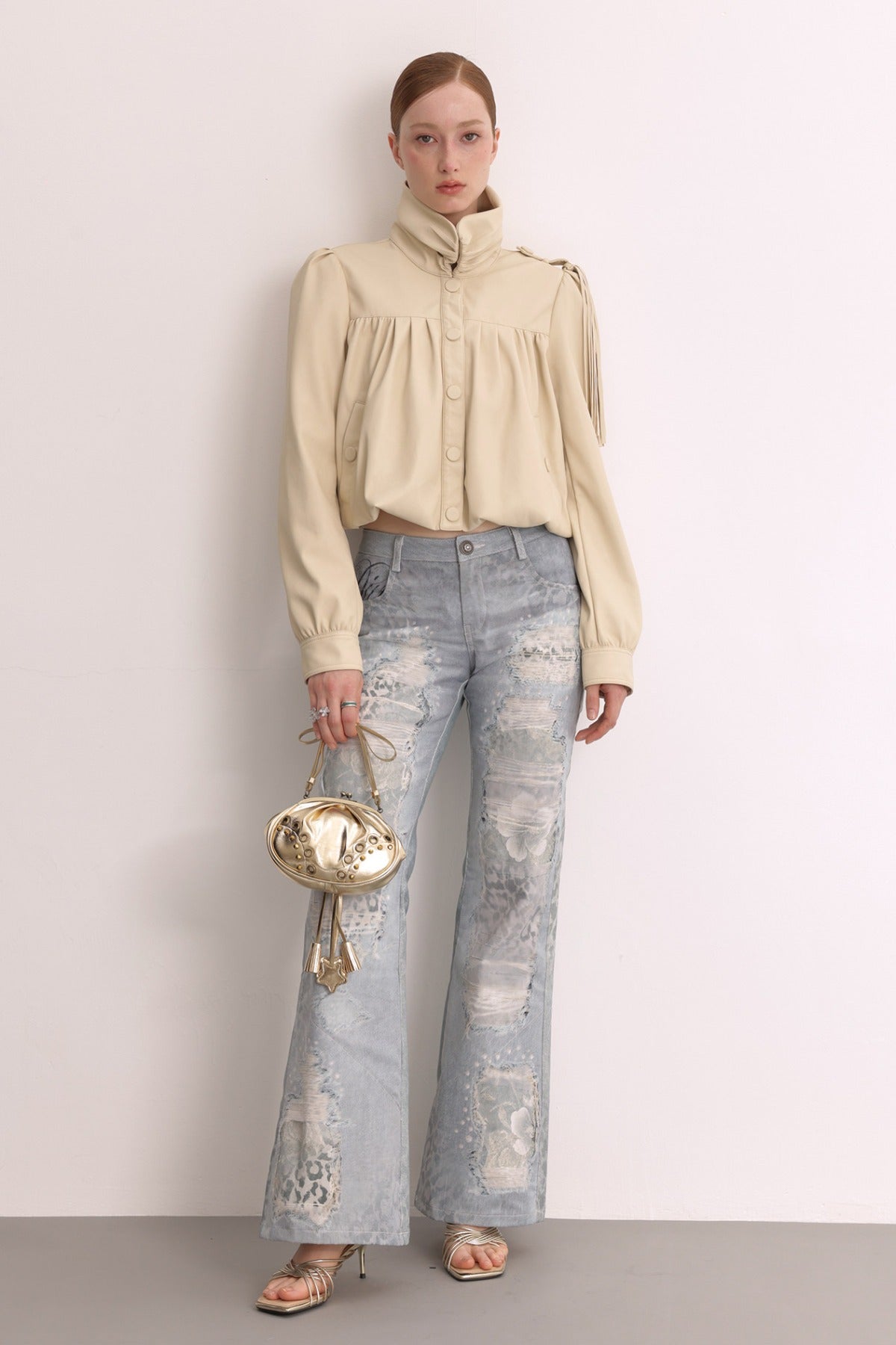 Jeans in mesh leopardato slavato a doppio strato