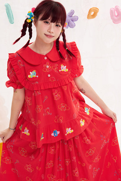 Blusa rossa con ricamo animale e angelo
