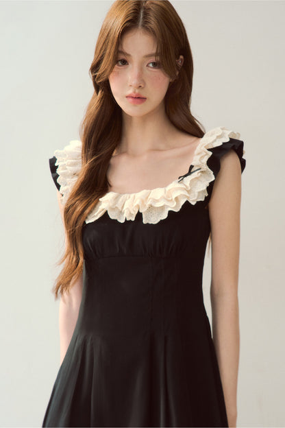 Robe noire à épaules dénudées avec bordure en dentelle au style tendance