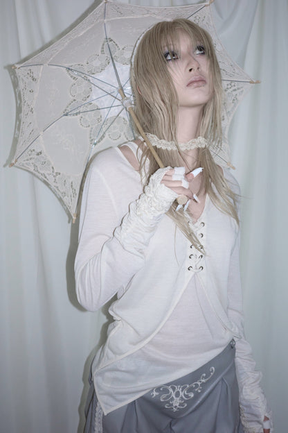 Blusa ricamata con orlo irregolare
