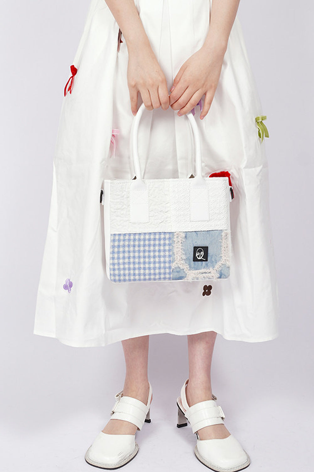 Borsa tote quadrata piccola a toppe con cuciture