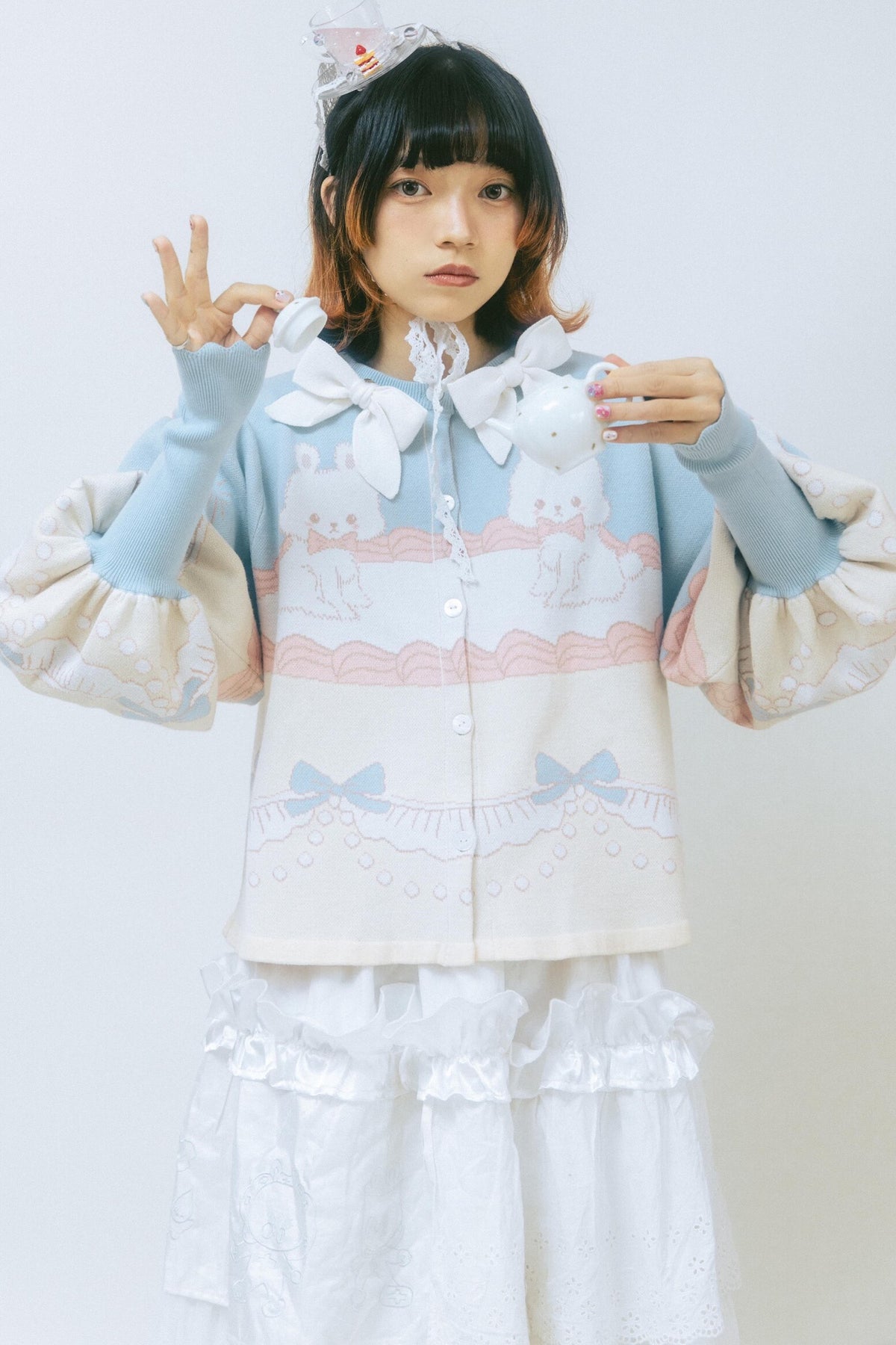 Cardigan a maglia con fiocco e coniglio