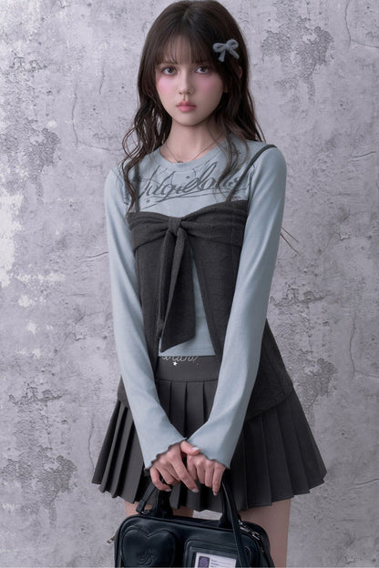 Blusa a maniche lunghe blu-grigia con fiocco e effetto a strati
