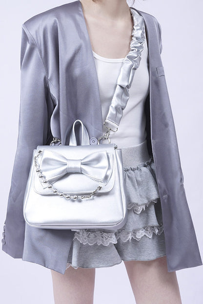 Silver Bow Crossbody Backpack