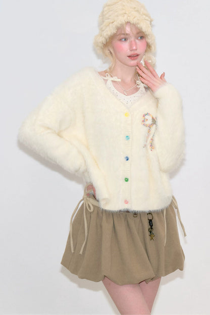 Apricotfarbene Strickjacke mit Schleife