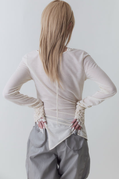 Blusa ricamata con orlo irregolare